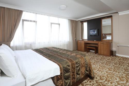 Postel nebo postele na pokoji v ubytování Balturk Hotel Sakarya