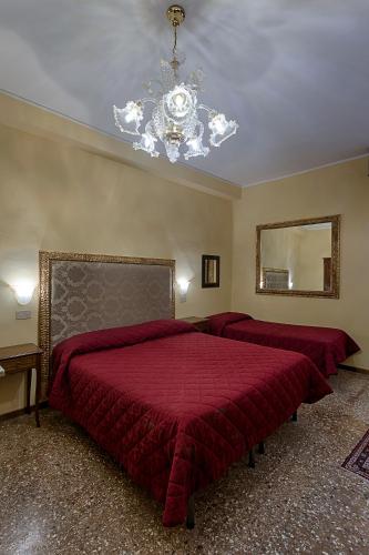 Ένα ή περισσότερα κρεβάτια σε δωμάτιο στο Hotel Guerrato
