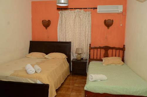 Postel nebo postele na pokoji v ubytování Dookee House