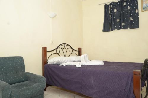 Postel nebo postele na pokoji v ubytování Dookee House