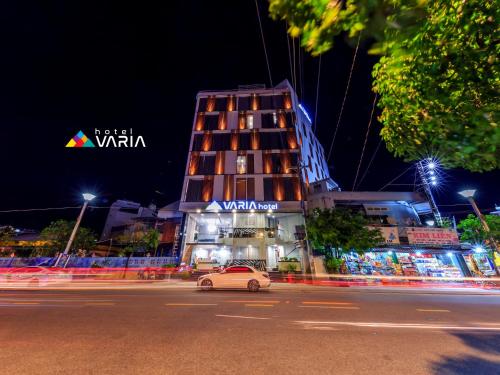 a car parked in front of a building at night at VARIA Hotel Phu Quoc in Phu Quoc