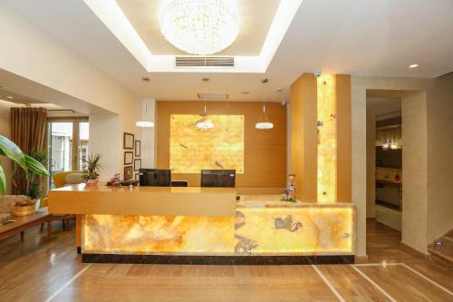a lobby with a reception desk in a building at Oxford hotel in Tirana