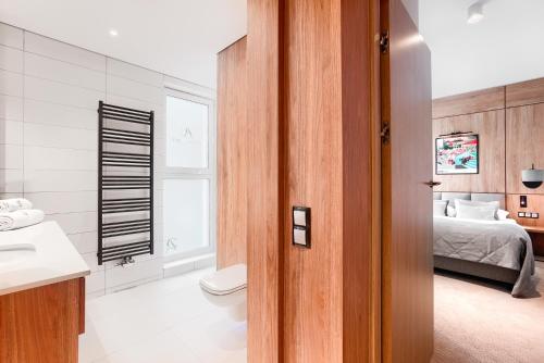 Postel nebo postele na pokoji v ubytování City Apartments - Marii Ludwiki 7