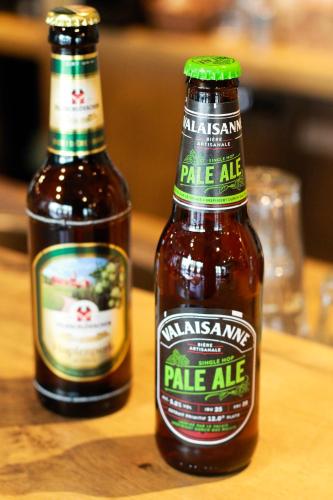 two bottles of ale ale on a wooden table at ibis Zürich Messe Airport in Zürich