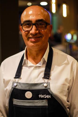 a man wearing glasses and an apron at ibis Zürich Messe Airport in Zürich