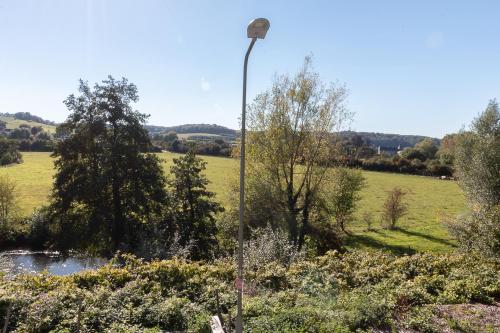 a street light on a pole in a field at Appartement Schin op Geul in Schin op Geul