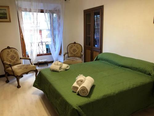 Postel nebo postele na pokoji v ubytování Ottaviano Lodge