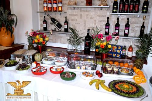 a buffet with food and bottles of wine at Rheinhotel Bellavista in Braubach