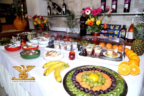 a buffet of food on a table with fruits and vegetables at Rheinhotel Bellavista in Braubach