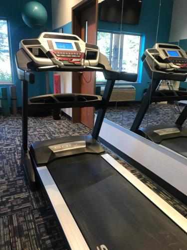 a gym with two treadmills in a room at Wood River Inn & Suite in Hailey