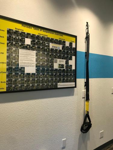 a tool hanging on a wall with a poster on the wall at Wood River Inn & Suite in Hailey