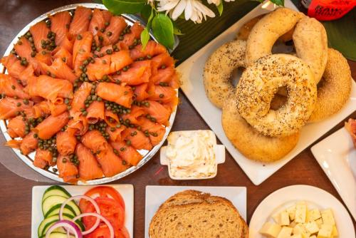 a table topped with different types of food and pretzels at Old Town Manor in Key West