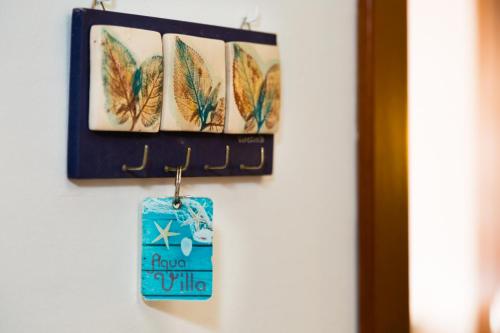 a group of feathers hanging on a wall at Aquavilla in Costa Teguise