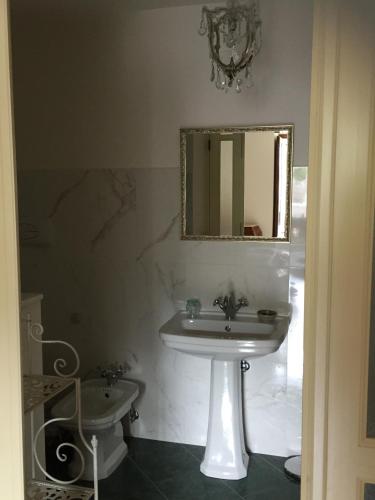 a bathroom with a sink and a mirror at Villa Caterina in Sapri