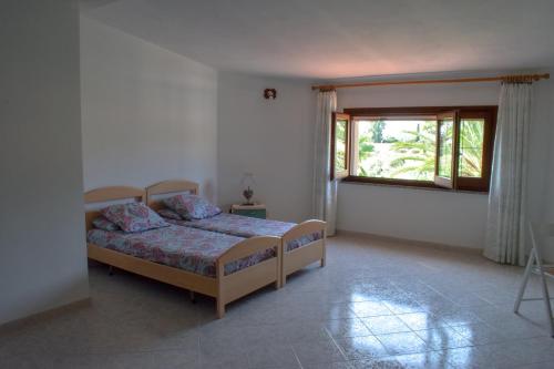 Postel nebo postele na pokoji v ubytování villa sa perdera