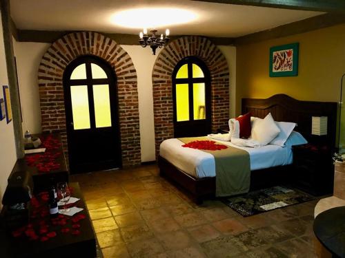 Postel nebo postele na pokoji v ubytování Spa Holistico Real Hotel