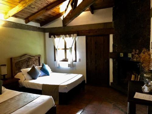 Postel nebo postele na pokoji v ubytování Spa Holistico Real Hotel