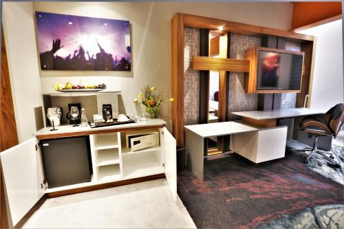 a room with a desk and a computer in it at Hard Rock Hotel Guadalajara in Guadalajara