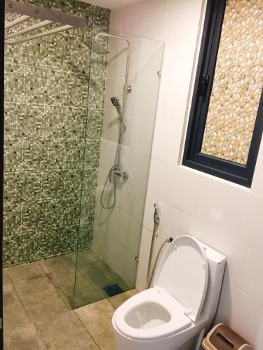a bathroom with a shower and a toilet at Perfect Getaway @Vivacity in Kuching
