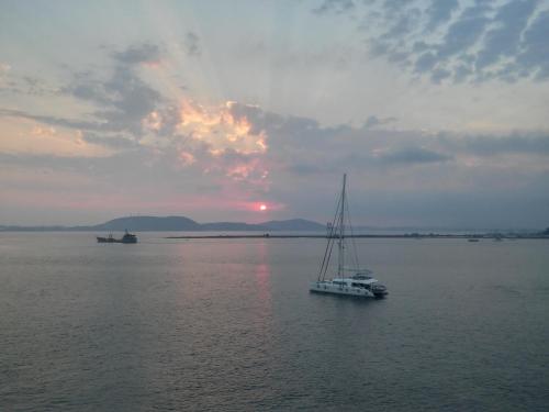 a boat in the middle of a large body of water at Hotel Avra in Preveza