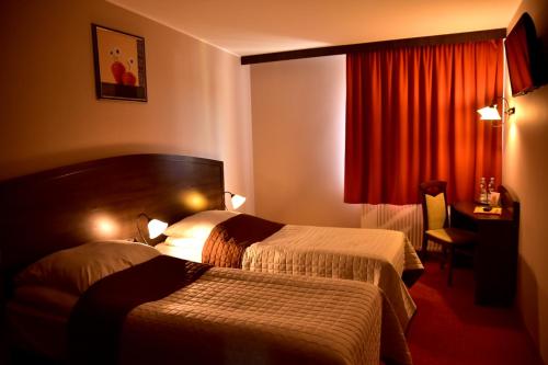 Postel nebo postele na pokoji v ubytování Hotel Nekla