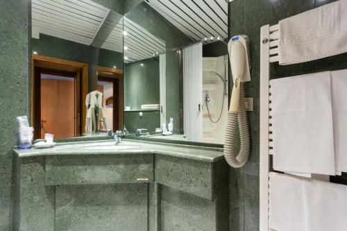 Koupelna v ubytování Albergo Il Cacciatore