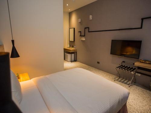 Postel nebo postele na pokoji v ubytování Rainbow Hotel
