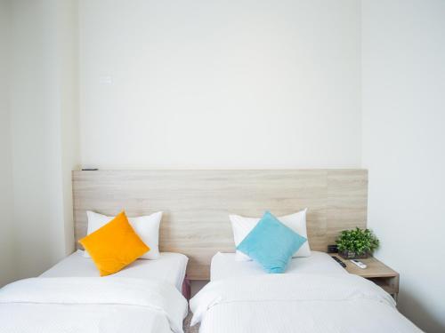 Postel nebo postele na pokoji v ubytování Rainbow Hotel