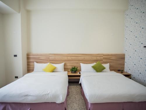 Postel nebo postele na pokoji v ubytování Rainbow Hotel