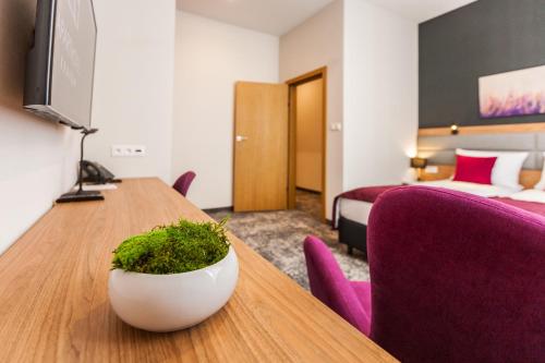 Postel nebo postele na pokoji v ubytování K4 APARTHOTEL KRAKÓW