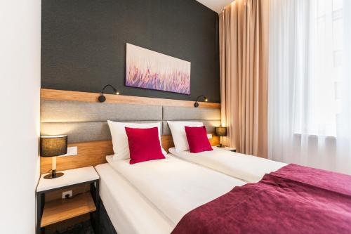 Postel nebo postele na pokoji v ubytování K4 APARTHOTEL KRAKÓW