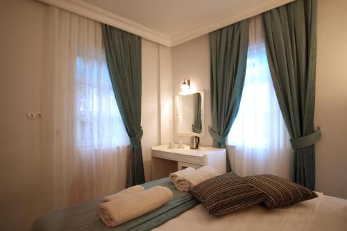 Letto o letti in una camera di Petunya Konak Boutique Hotel
