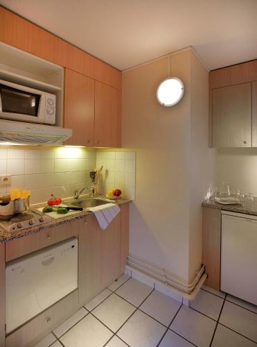 Η κουζίνα ή μικρή κουζίνα στο Citadines Wilson Toulouse