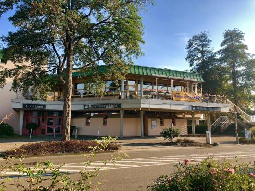 a building with a balcony on the side of a street at Hotel „Zur Linde“ in Ehingen