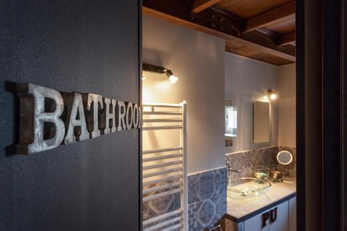 a bathroom with a sink and a mirror at Loft Navona in Rome