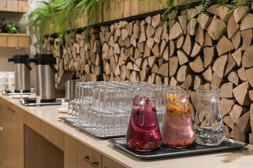 a counter with many glass vases on a tray at Kubija Hotel and NatureSpa in Võru