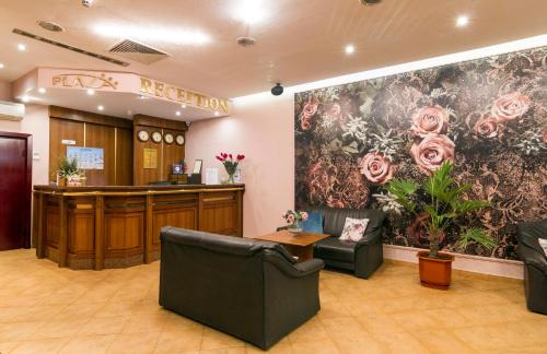 a waiting room with a flower wall in a hospital at Plaza Hotel in Varna City