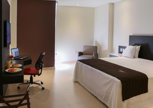 Ένα ή περισσότερα κρεβάτια σε δωμάτιο στο Diverxo Hotel & Villas