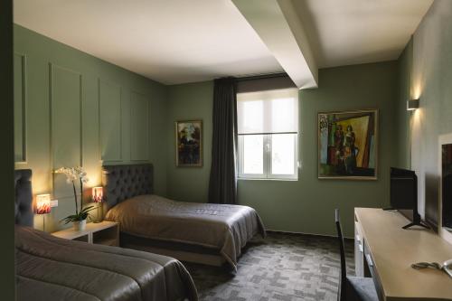 En eller flere senger på et rom på Romantique Veles Hotel