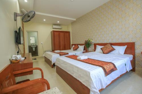 Postel nebo postele na pokoji v ubytování Cat Ba Green Hotel