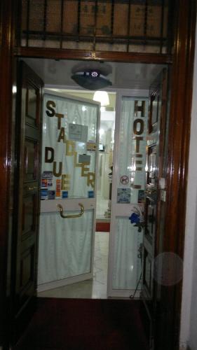 a doorway to a store with a sign on the door at Hotel Stadler 2 in Rome