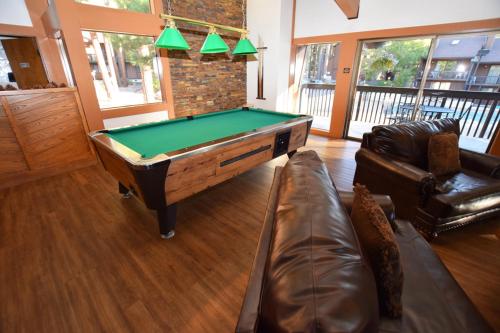 a living room with a pool table and a couch at Club Tahoe Resort in Incline Village