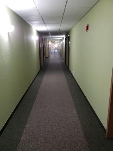 an empty hallway in an office building at Harbor Lights Lodge in Kewaunee