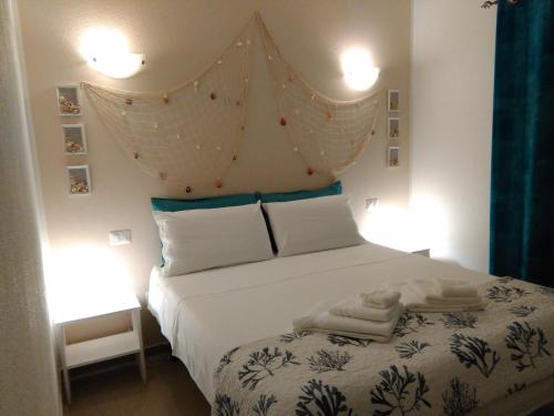 Tempat tidur dalam kamar di Casa Marina Maria