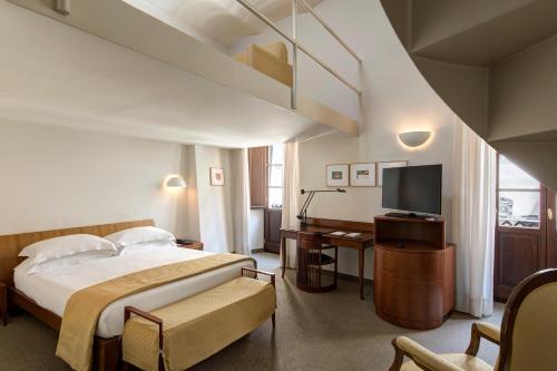 Postel nebo postele na pokoji v ubytování Hotel Tiferno