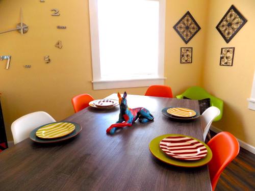 a dining room table with a spiderman toy on it at Casa California - Backyard, BBQ, Firepit & Near Beaches in San Diego