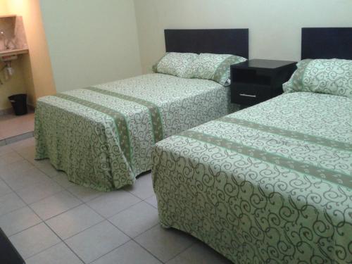 Voodi või voodid majutusasutuse Hotel Panama 510 toas