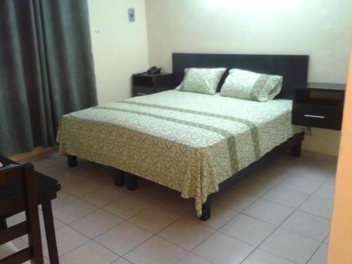 Ένα ή περισσότερα κρεβάτια σε δωμάτιο στο Hotel Panama 510