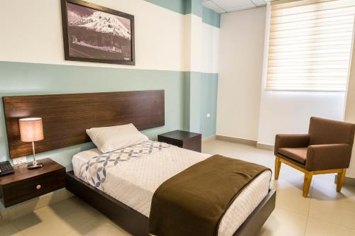 Postel nebo postele na pokoji v ubytování ZAFRA'S HOTEL