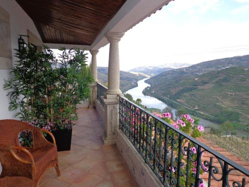 a balcony with a view of a river at Casa De Canilhas in Mesão Frio